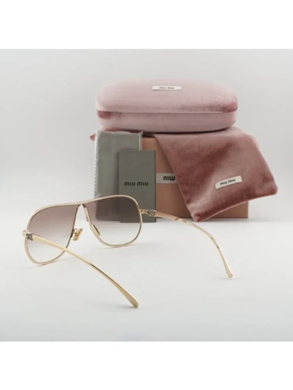 Miu Miu MUA56S 5AK90L Geometric Sunglasses – Gold/Brown Gradient
